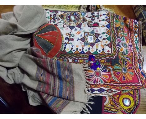 Collection of Eastern embroidered and mirror inset panels and table runners and other Eastern textiles