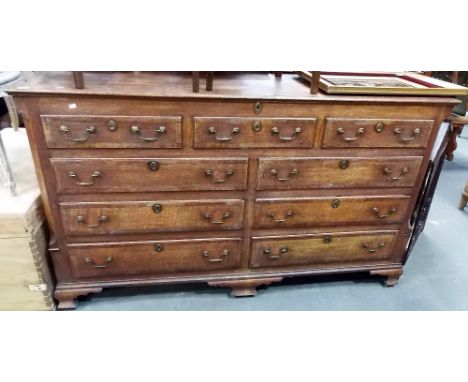 George III mahogany cross-banded Lancashire mule chest, the hinged top over three false drawers and arrangements of six drawe