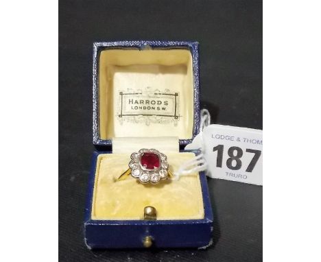 Good Edwardian gold and platinum mounted diamond and ruby cluster ring, the ten brilliant cut diamonds of 0.10 carat approx w