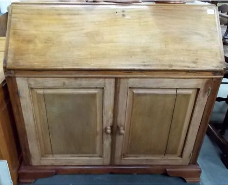 20th Century mahogany bureau with fitted interior over two cupboard doors and on ogee bracket feet, width 40.25'