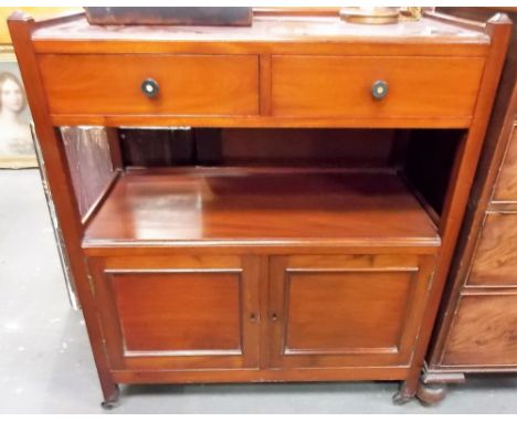 Early 20th Century mahogany buffet, the top with two frieze drawers with open recess and two cupboard doors and ceramic casto