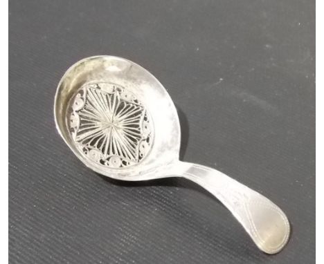 George III silver caddy spoon, the bowl with pieced filigree centre, the handle with bright cut decoration, maker TW, indisti