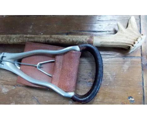 A walking stick with antler whistle handle, together with a shooting stick (2).