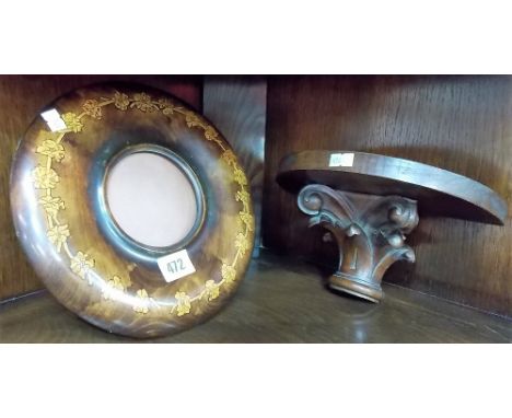 Circular wooden pokerwork photograph frame; together with a carved wood bracket.
