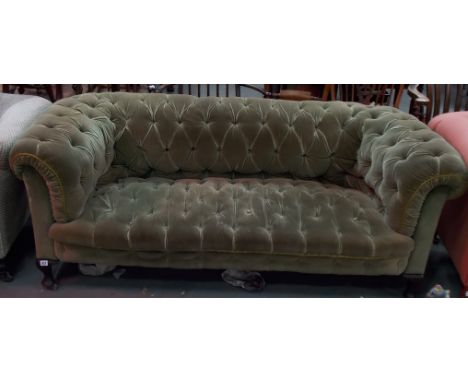 Victorian button back upholstered Chesterfield settee with squat cabriole legs with castors, width 70'