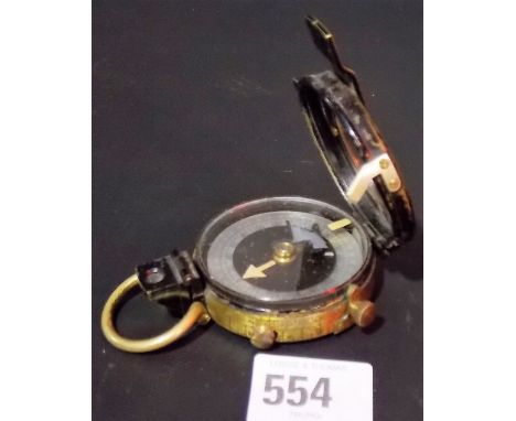 WWI period military black lacquered pocket compass signed Cuehn, Geneve no. 113 and with broad arrow mark, dated 1918.