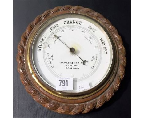 Oak cased aneroid barometer with rope twist carved border, the enamel dial signed James Ellis & Co, Scarboro, diameter 9'