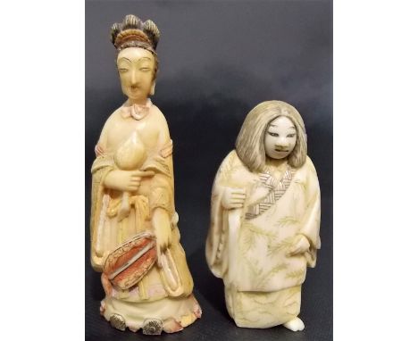 Japanese ivory netsuke modelled as a portly woman with a swivel lady and grotesque face, signed to the base, height 2'; toget