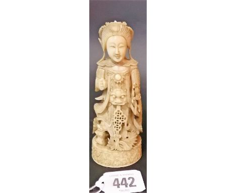 18th/19th Century Chinese export ivory chess piece, carved as a figure in ceremonial dress upon an oval foliate scroll carved