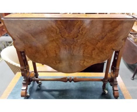 Good Victorian figured walnut veneered oval serpentine shaped Sutherland table, upon scroll pierced supports and turned stret