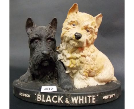 Vintage resin moulded Scotch black & white whiskey terrier dog bar ornament.