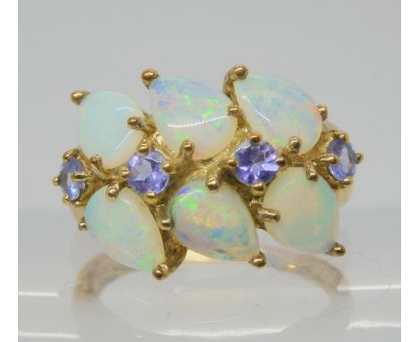A 9ct gold QVC branded opal and tanzanite cluster ring, size O1/2, weight 3.8gms Condition Report:Available upon request