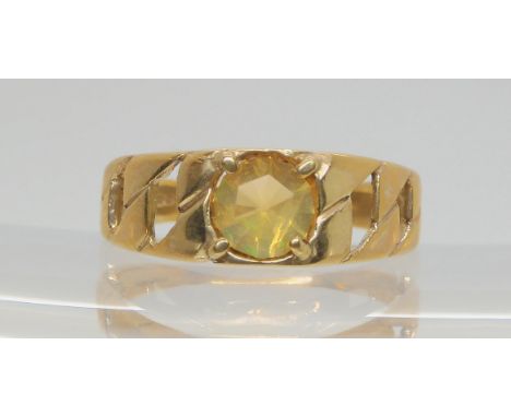 A 9ct gold chain pattern ring, set with a fire opal, size U, weight 3.2gms Condition Report:Available upon request