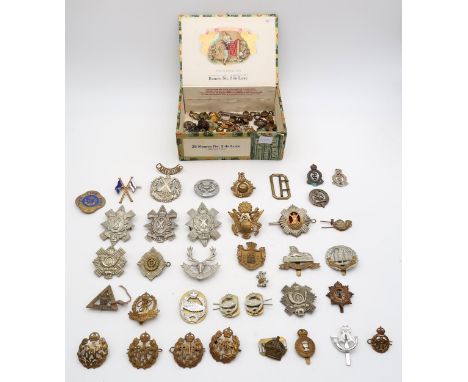 A collection of military and other cap badges, rank pips, buttons etc., to include the Black Watch, Royal Scots, Cameron High