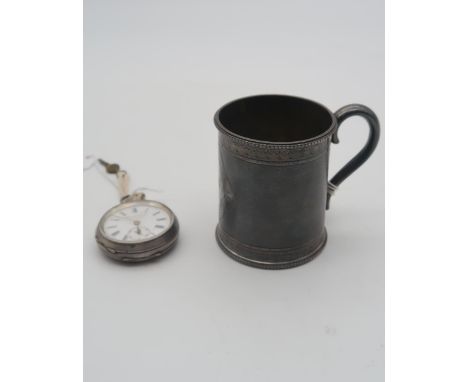 A Victorian Scottish silver tankard, the body with engine turned decoration and bands, the rims beaded, with an S-shaped hand