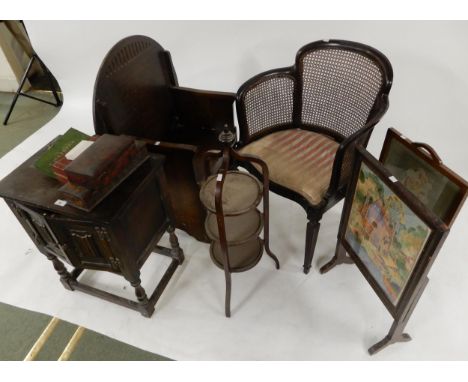 A 20th century oak metamorphic table/chair, bergere armchair, three tier cake stand, two tapestry fire screen and a linen fol