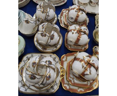 A Roslyn China teaset with pink and gilt decoration on white ground, together with a Royal Worcester teaset with decoration o