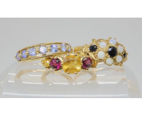 Two 9ct QVC branded rings, set with tanzanites, citrines and garnet, sizes P1/2 and O, together with a sapphire and opal clus