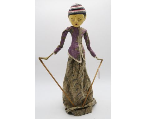 An Indonesian Wayang Golek rod puppet, placed in a glass decanter for display Condition Report:Available upon request