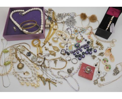 A silver bangle, a boxed Jon Richards diamante tennis bracelet, vintage Butlins badges and other items Condition Report:Not a