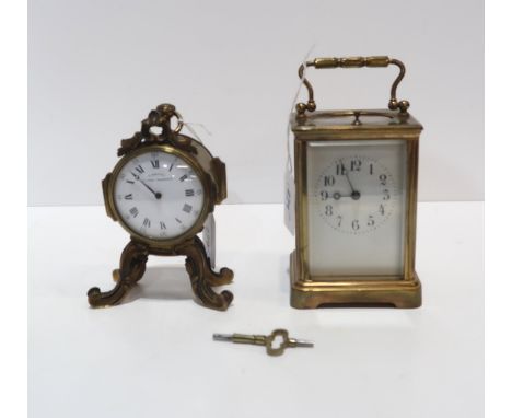 A small desk clock, the dial marked E Dreyfous, with roman numerals and in gilt metal mount together with a repeating carriag