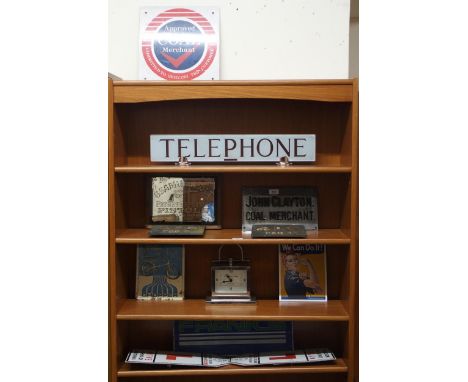A mixed lot to include a frosted glass telephone sign, two coal merchant signs, reproduction Colt pistols advertising mirror,