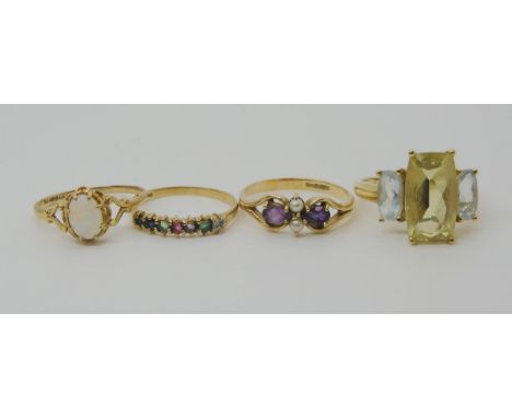 A 9ct gold mixed gem 'dearest' ring, size M, 9ct opal ring, size M1/2, and two further gem set rings, weight combined 8.1gms 
