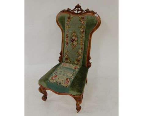 A Victorian walnut framed Prie Dieu chair with floral tapestry upholstery on cabriole supports Condition Report:Available upo