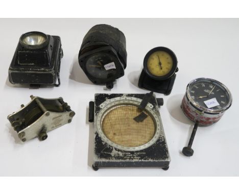 A mixed lot of automotive and aviation gauges, comprising a military altimeter, dashboard clock by British Jaeger, Rototherm 