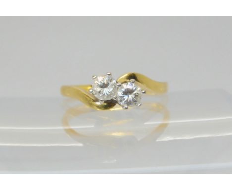 An 18ct gold twin diamond ring, set with estimated approx 0.50cts of brilliant cut diamonds combined, finger size N1/2, weigh