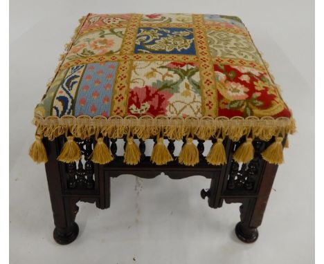 An eastern footstool in the manner of Liberty &amp; Co "Cairo" stool with tapestry upholstery Condition Report:Available upon