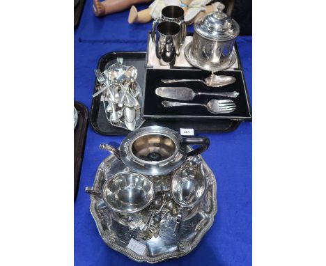 A collection of EPNS including a three piece tea service, souvenir spoons, a shaped tray with engraved decoration, a biscuit 