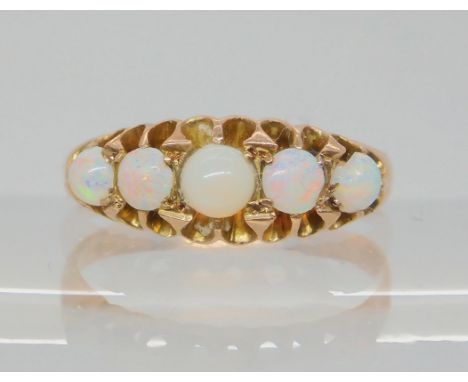 A 9ct gold five opal ring, size R, weight 2.5gms Condition Report:Two opals are chipped