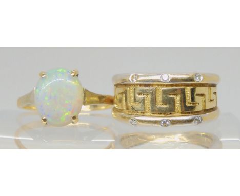 A 9ct yellow and white gold key pattern ring set with diamond accents, size J1/2 together with a 9ct opal ring, size J1/2, we