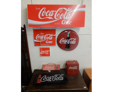 A mixed lot of assorted Coca Cola items to include two illuminated advertising signs, three further signs, clock face (lackin