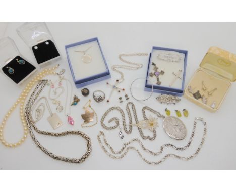 A large silver locket on a long rope chain, retailed by Georg Jensen, stamped GJLd, a silver kangaroo and opal pendant, a hea