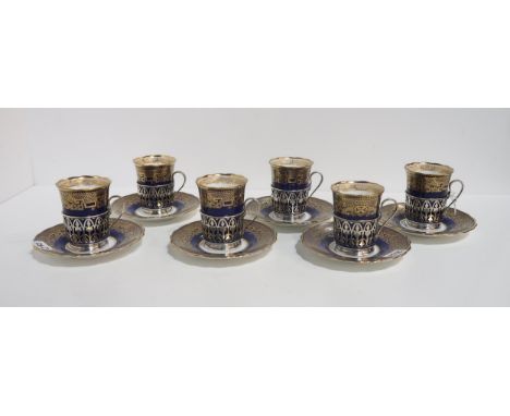 A set of Walker and Hall mounted Coalport coffee cans and saucers Condition Report:Available upon request