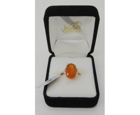 A 9ct gold fire opal and diamond ring, retailed by The Jewellery Channel, as new with tags, size O, weight 2.9gms Condition R