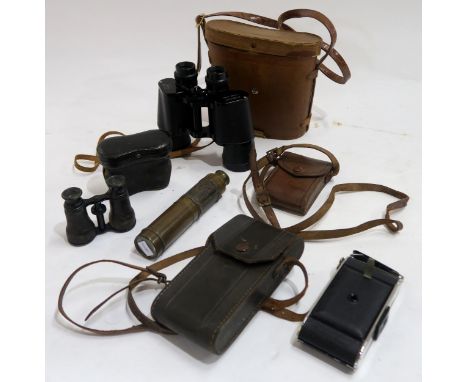 A brass three-draw telescope, Victorian opera glasses in leather case, binoculars by Everest and an assortment of vintage cam