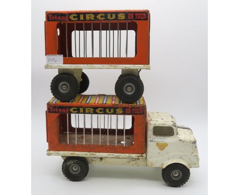 A Tri-ang "Circus on Tour" truck and trailer; and an assortment of smaller toy vehicles, to include Pocketoy clockwork cars a