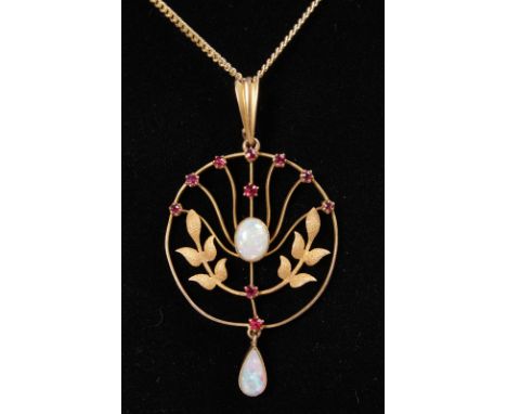AN EDWARDIAN 15CT YELLOW GOLD, OPAL AND RUBY SET PENDANT on a chain.