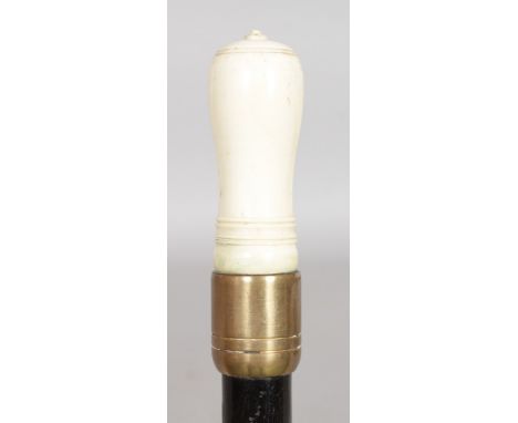 AN IVORY APPLE CORER ON A MALACCA SHAFT. Date: 1900. Country: European.A picnic stick formed with an ivory two part apple cor