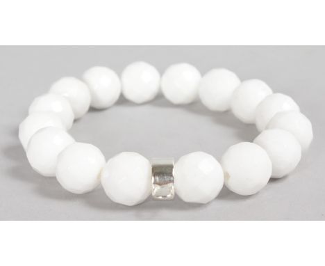 A WHITE JADE AND SILVER BRACELET.