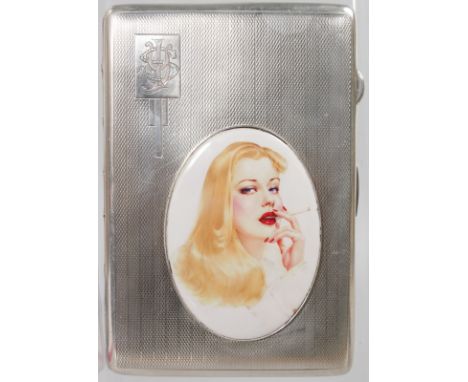 A GEORGE V ENGINE TURNED CIGARETTE CASE, Birmingham 1921, with an oval plaque of a woman smoking a cigarette.