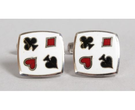 A PAIR OF ACES ENAMEL AND SILVER SKULL CUFFLINKS.
