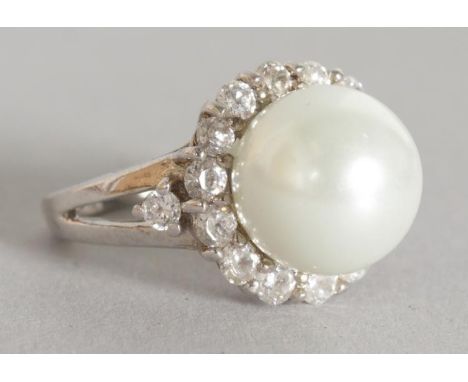 A SILVER, PEARL AND BRILLIANT RING.