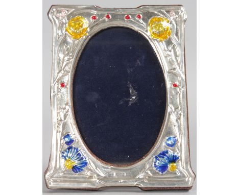 AN ART NOUVEAU STYLE SILVER AND BLUE ENAMEL PHOTOGRAPH FRAME, 6ins high, with blue and yellow flowers.  Birmingham 1939.