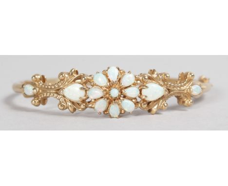 A LOVELY YELLOW GOLD AND OPAL FLORAL BRACELET.