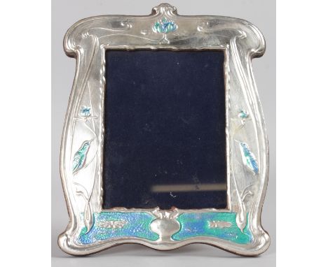 AN ART NOUVEAU STYLE SILVER AND BLUE ENAMEL PHOTOGRAPH FRAME, 8.5ins high, with birds and lilies. Birmingham .925.  Maker: RH