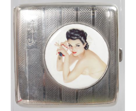 A GEORGE V ENGINE TURNED CIGARETTE CASE, Birmingham 1922, with a circular glamour model.
